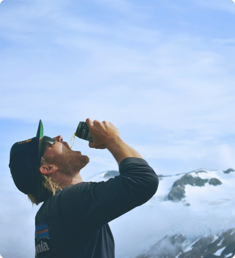 man-drinking-beer-on-mountain